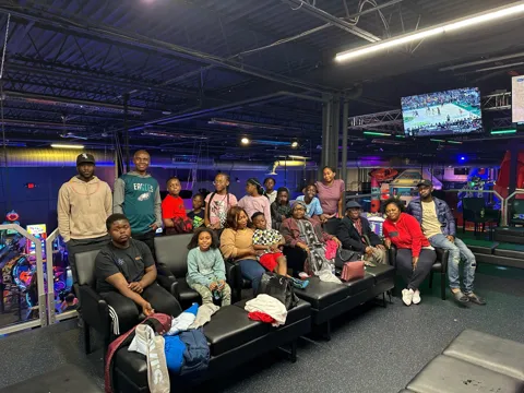 Large family group portrait at the arcade