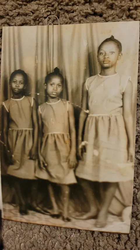 Vintage portrait of Memuna with her sisters as young girls